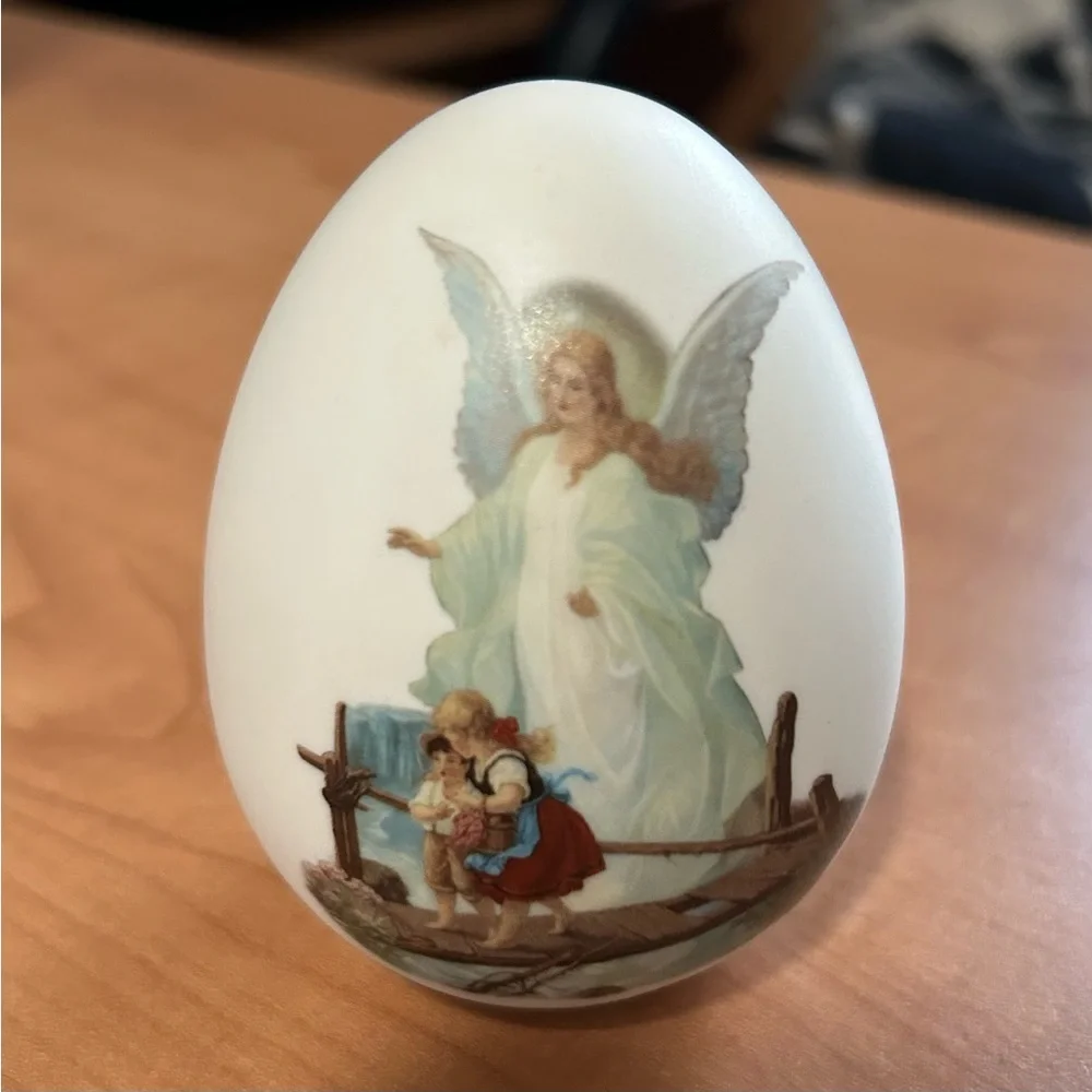 vintage porcelain egg with painting of guardian angel watching over children